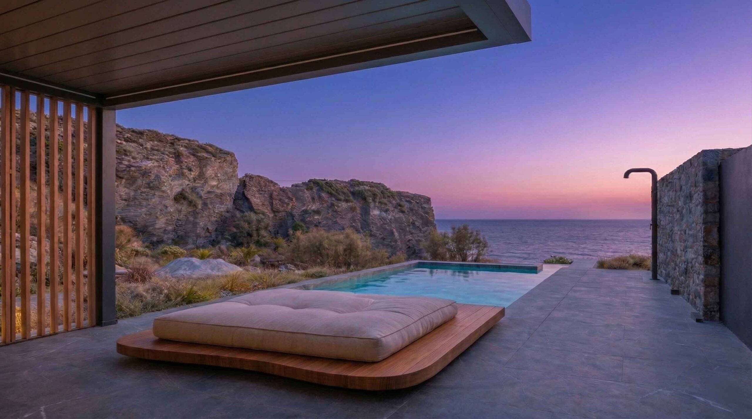 Sunset infinity pool lounge with sea view and rocky backdrop at Lapis Nera Villas at Heraklion